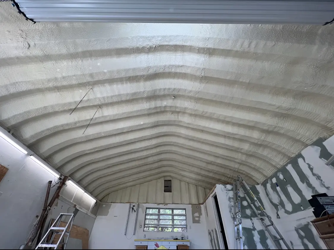 Spray polyurethane foam applied to the underside of a metal roof deck in League City